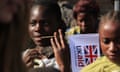 African child holding a UK aid flag in DRC 