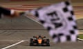 McLaren's Oscar Piastri passes the chequered flag to win the Bahrain Grand Prix.