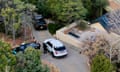 Law enforcement officers at the home of Gene Hackman and Betsy Arakawa the day after their bodies were discovered.
