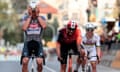 Mathieu van der Poel crosses the line ahead of Filippo Ganna and Tadej Pogacar.
