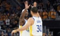 Golden State Warriors forward Jimmy Butler, left, celebrates with guard Stephen Curry (30) during the first half of Wednesday’s win over the Memphis Grizzlies.