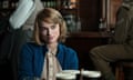 Knightley sits at a table in a bar in The Imitation Game.