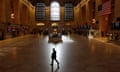 a person walking at a train station with no one around