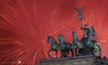 Fireworks light the sky above the Brandenburg Gate shortly after midnight in Berlin, Friday, Jan. 1, 2016. Hundred of thousands of people gathered for the New Year celebrations, welcoming the new year 2016 at the area around the Brandenburg Gate in the capital of Germany. (AP Photo/Markus Schreiber)