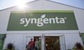 people walking out of a building displaying a Syngenta sign