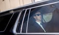Man wearing sunglasses in car