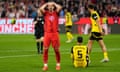 Bayern's Harry Kane holds his head during the 2-2 draw with Dortmund