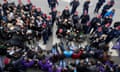 Police officers stand in front of protesters blocking the entrance to the Hungarian parliament in Budapest on 14 April.