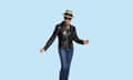 Portrait of Pauline Black in black leather jacket, jeans, trilby hat and black sunglasses