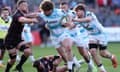 Alfie Barbeary (centre) holds off Ruan Ackermann to score Bath’s sixth try against Gloucester.
