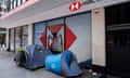 Two tents of people sleeping rough are set up on the pavement outside a branch of the bank HSBC
