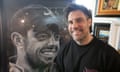 Jossie Pops with his painting, which is a monochrome head and shoulders portrait of the golfer smiling