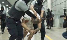 Kilmar Ábrego García is led by force by guards through the Terrorism Confinement Center in Tecoluca, El Salvador.