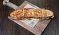 A cheese toastie on a board.