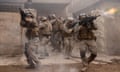 soliders in combat uniform with guns