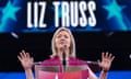 Liz Truss speaking on stage.