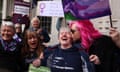 Women with placards and T-shirts bearing campaign slogans, such as 'No man can be a lesbian'