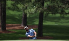 World No 1 Scottie Scheffler chips on to the green on the 7th during his second round at Augusta.