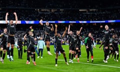 Arsenal celebrate after defeating Real Madrid in the Champions League quarter-final.